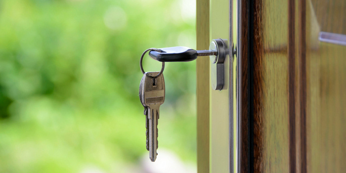 Photo of a key within a door lock