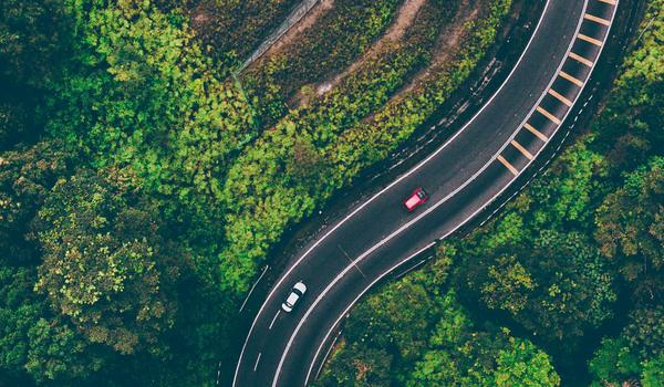 Photo of cars traveling mountain roads