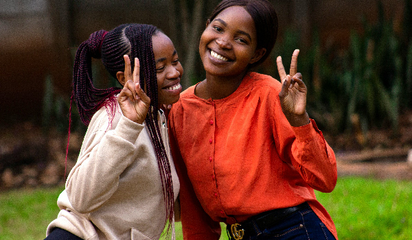 Two girls posing for a photo