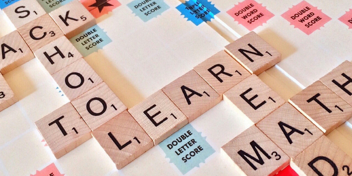 Photo of a board game with words such as learn or math written out