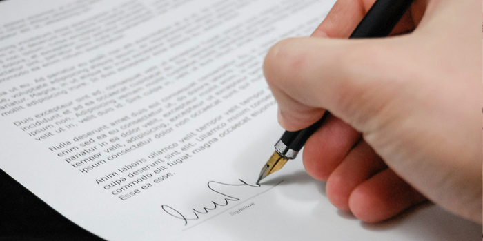 Photo of a Macon County financial document being filled out.