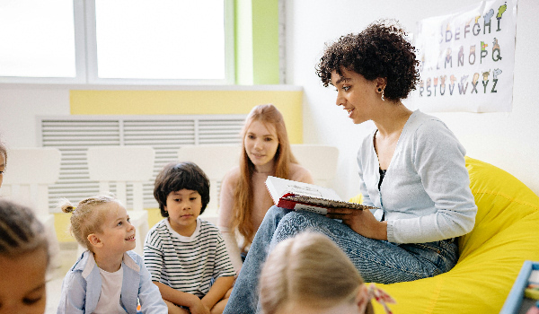 Photo of Teacher Reading to Students